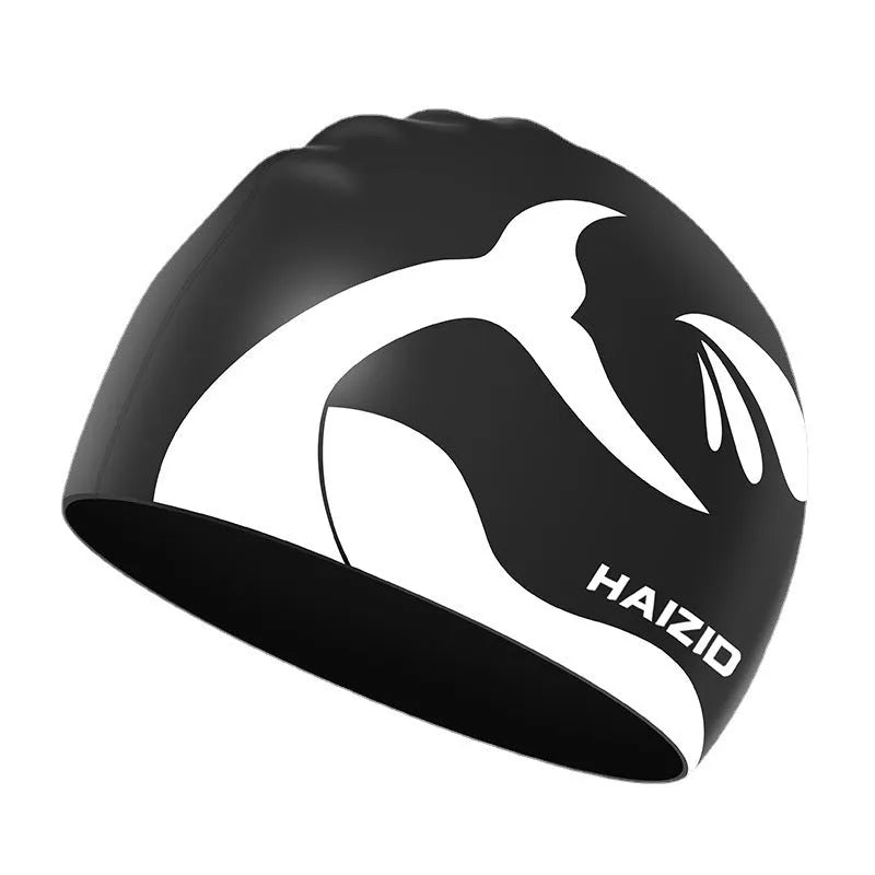 Silicone swimming cap with waterproof ear protectors showing whale tail pattern in assorted colours