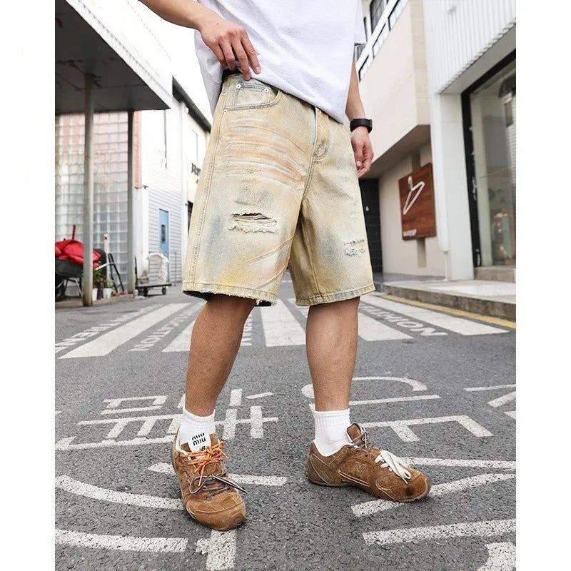 Light blue men's denim shorts with ripped details and a straight-leg fit