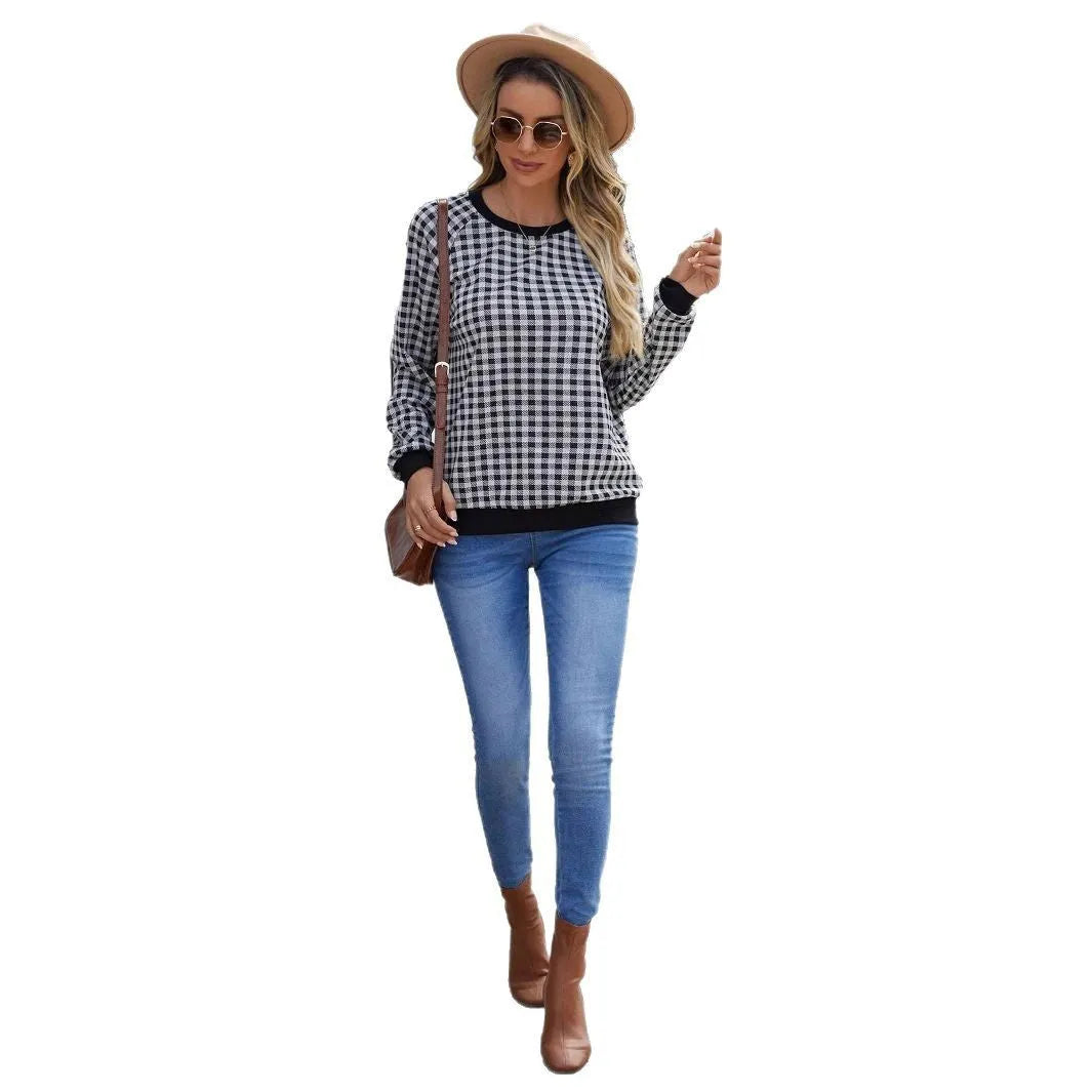 Black long sleeve pullover sweater with a classic plaid stripe print pattern.