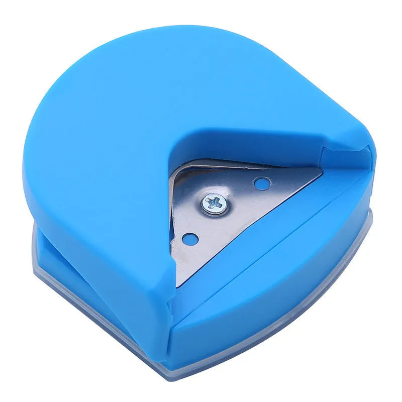 Black, blue, and pink plastic and metal business card corner cutter tool on a white background.