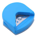 Black, blue, and pink plastic and metal business card corner cutter tool on a white background.