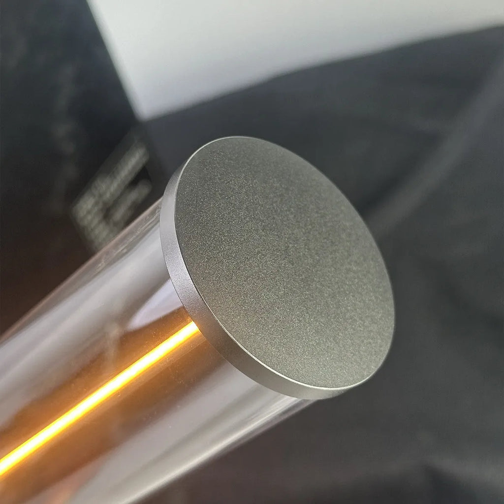 Modern glass USB LED night light with magnetic strip on a metal surface.