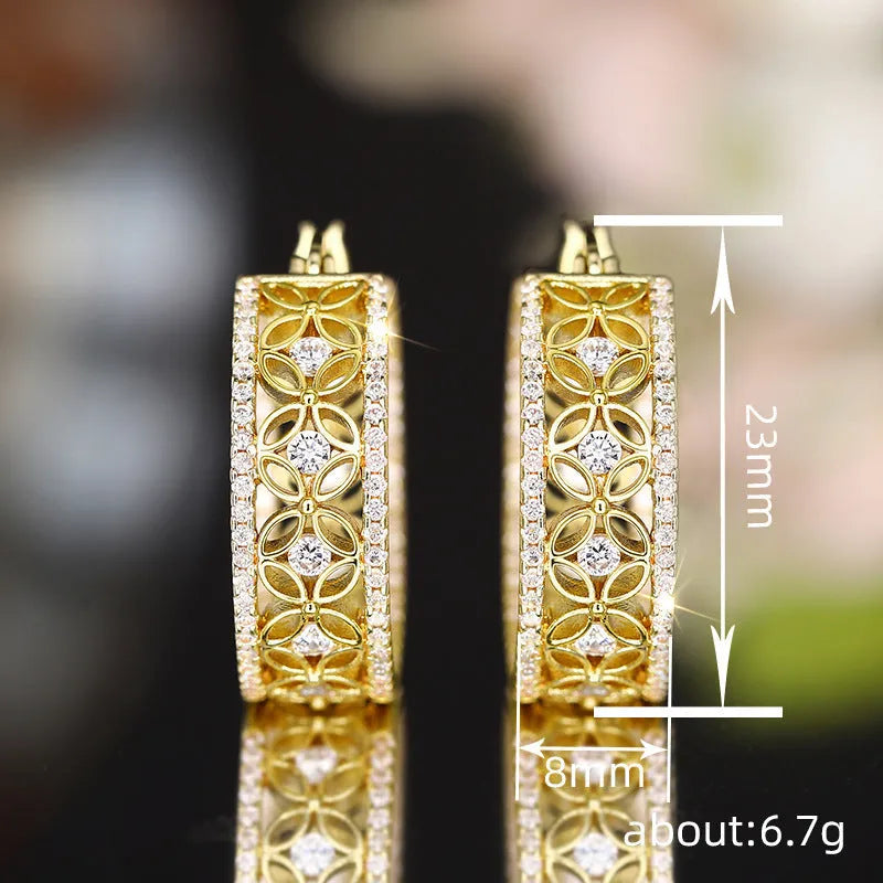 Geometric butterfly clip earrings with horse eye flower detail in yellow gold tone