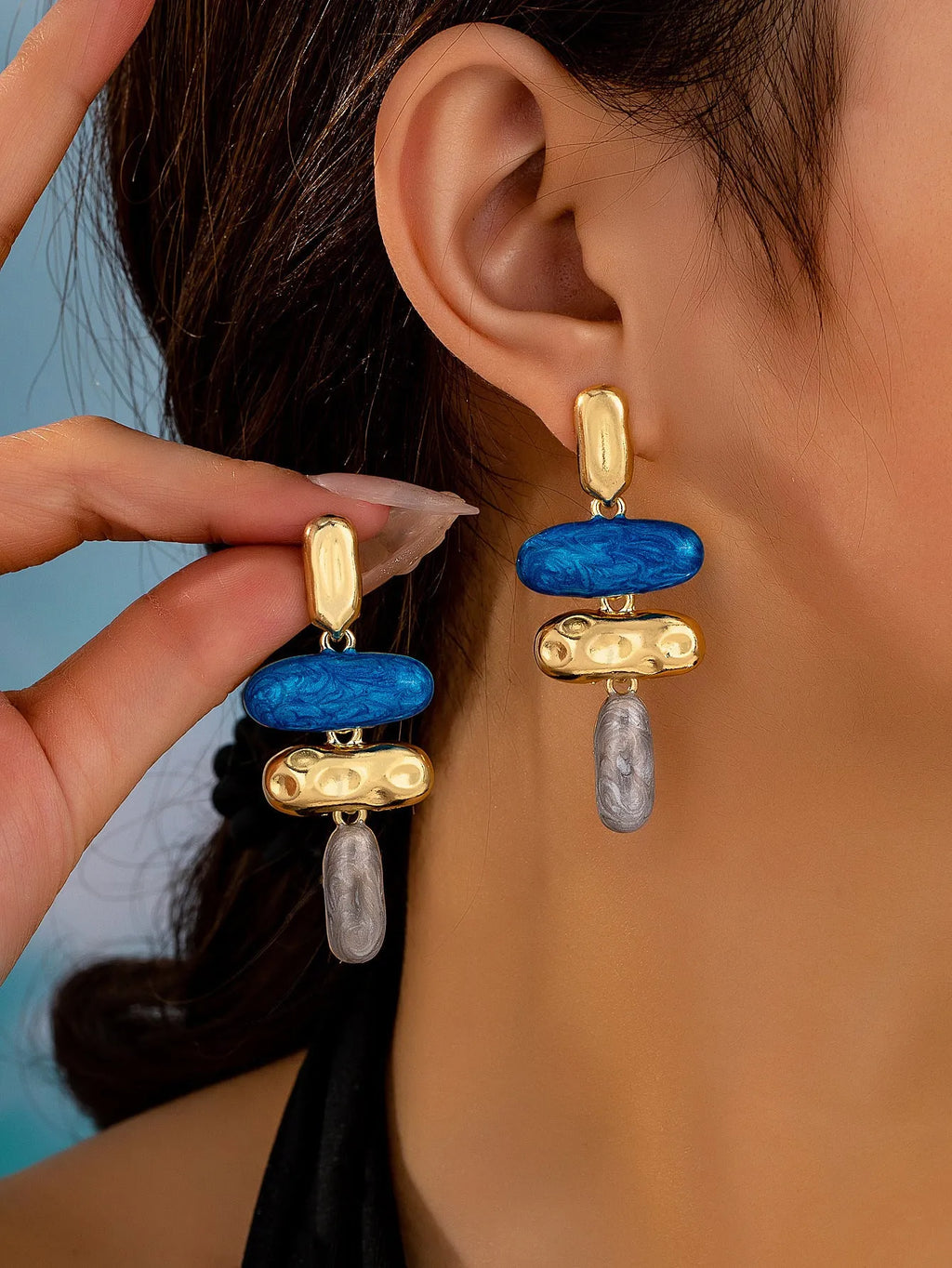 A pair of multicolour geometric stud earrings for women with a zinc alloy base and electroplated finish.
