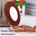 Roll of narrow 0.6cm wide polyester gift ribbon in a multicolour pattern.