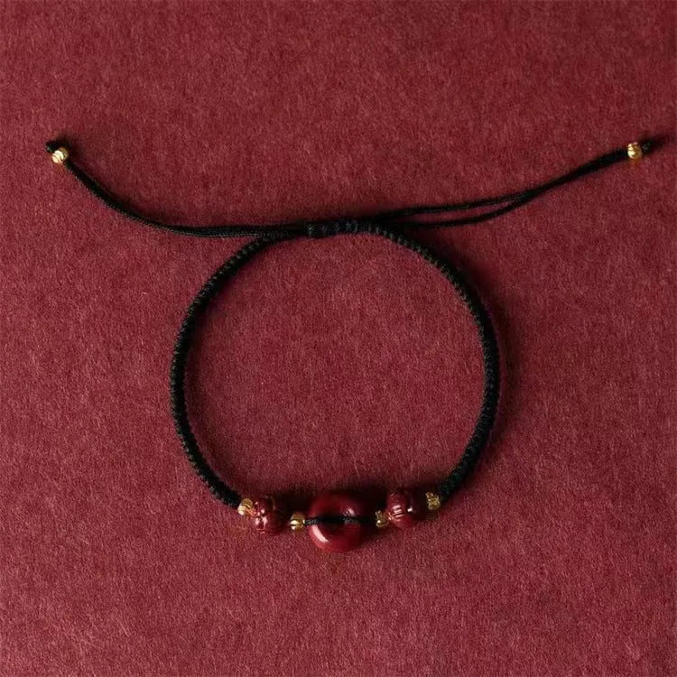Cinnabar heart charm bracelet with adjustable red rope and traditional safety buckle in multiple colour options