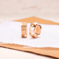 Rose gold hollow heart-shaped women's earrings with a circular sweet style design.