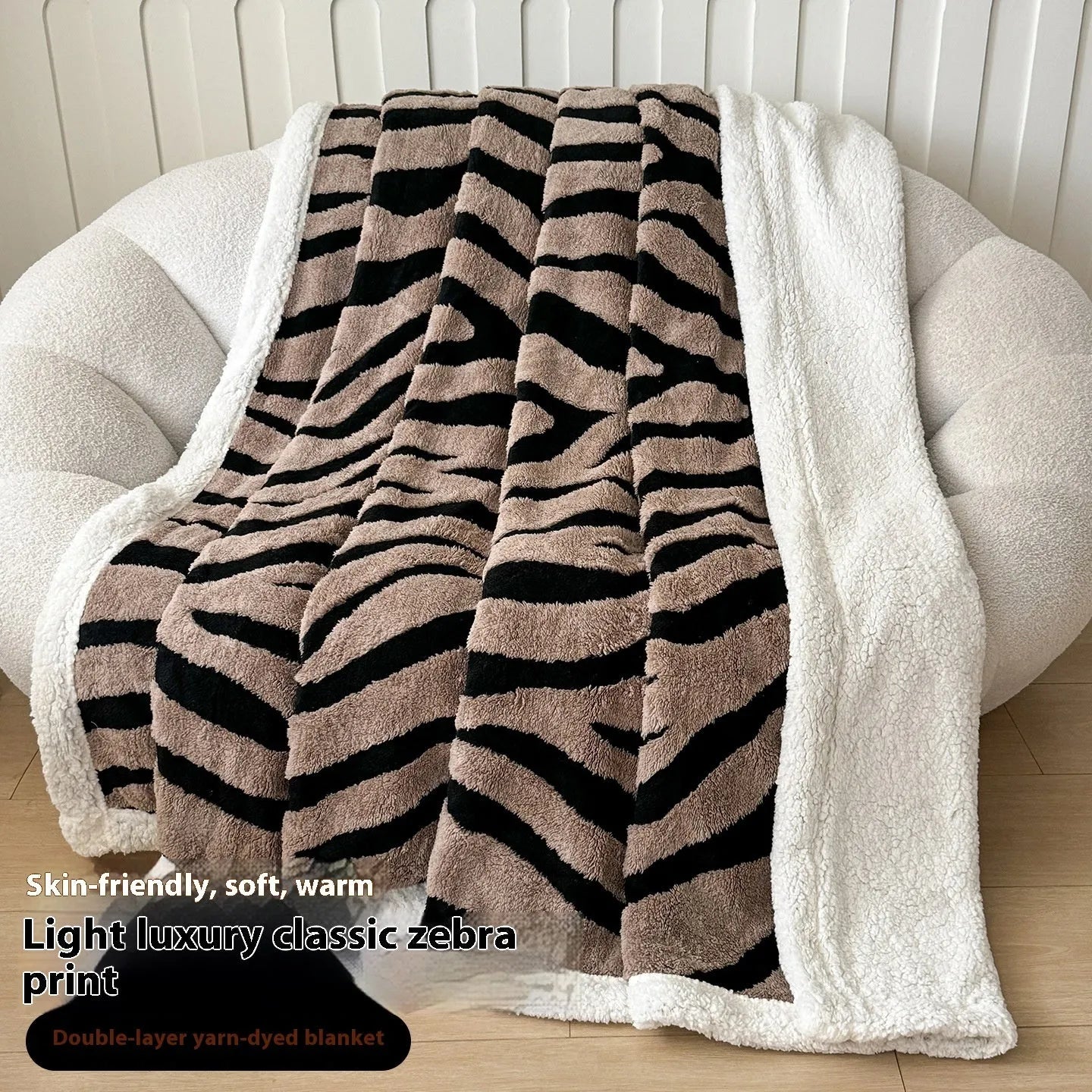 Double-layer cationic leopard jacquard taffeta blanket showing reversible design with zebra pattern