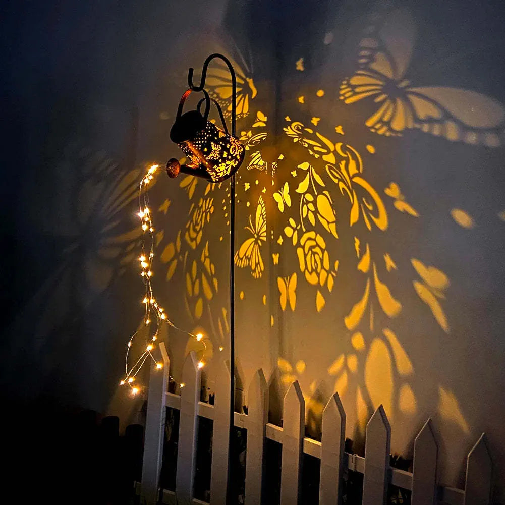 Iron solar garden lamp with tapered butterfly pattern and warm white LED light.