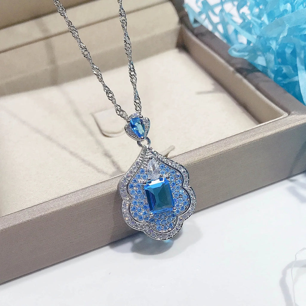 Sea blue geometric copper pendant with aquamarine topaz sky mirror appearance