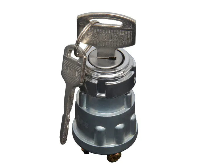 Copper vehicle ignition switch with a key for trucks and forklifts.