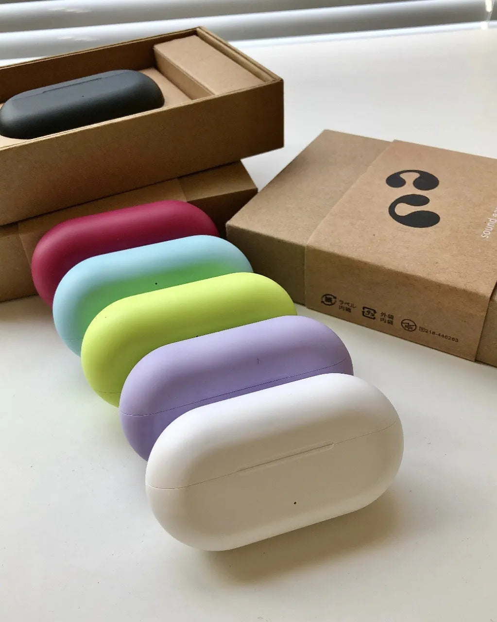 Bone conduction ear clip headset in macaron colours with Qualcomm chip and 20 metre range