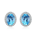 925 sterling silver blue topaz geometric jewellery set showing necklace, earrings, ring, and pendant