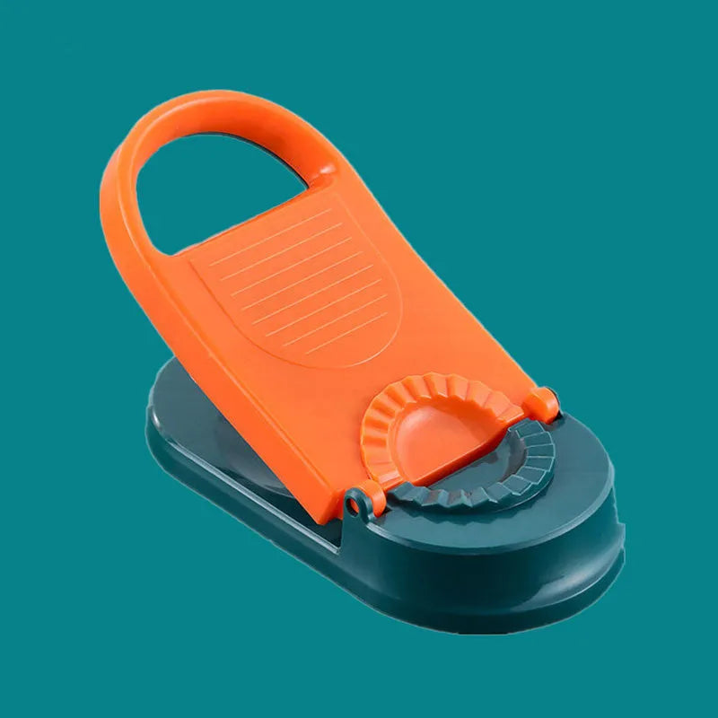 Orange and white manual dumpling skin press tool with ergonomic handle and hanging hole