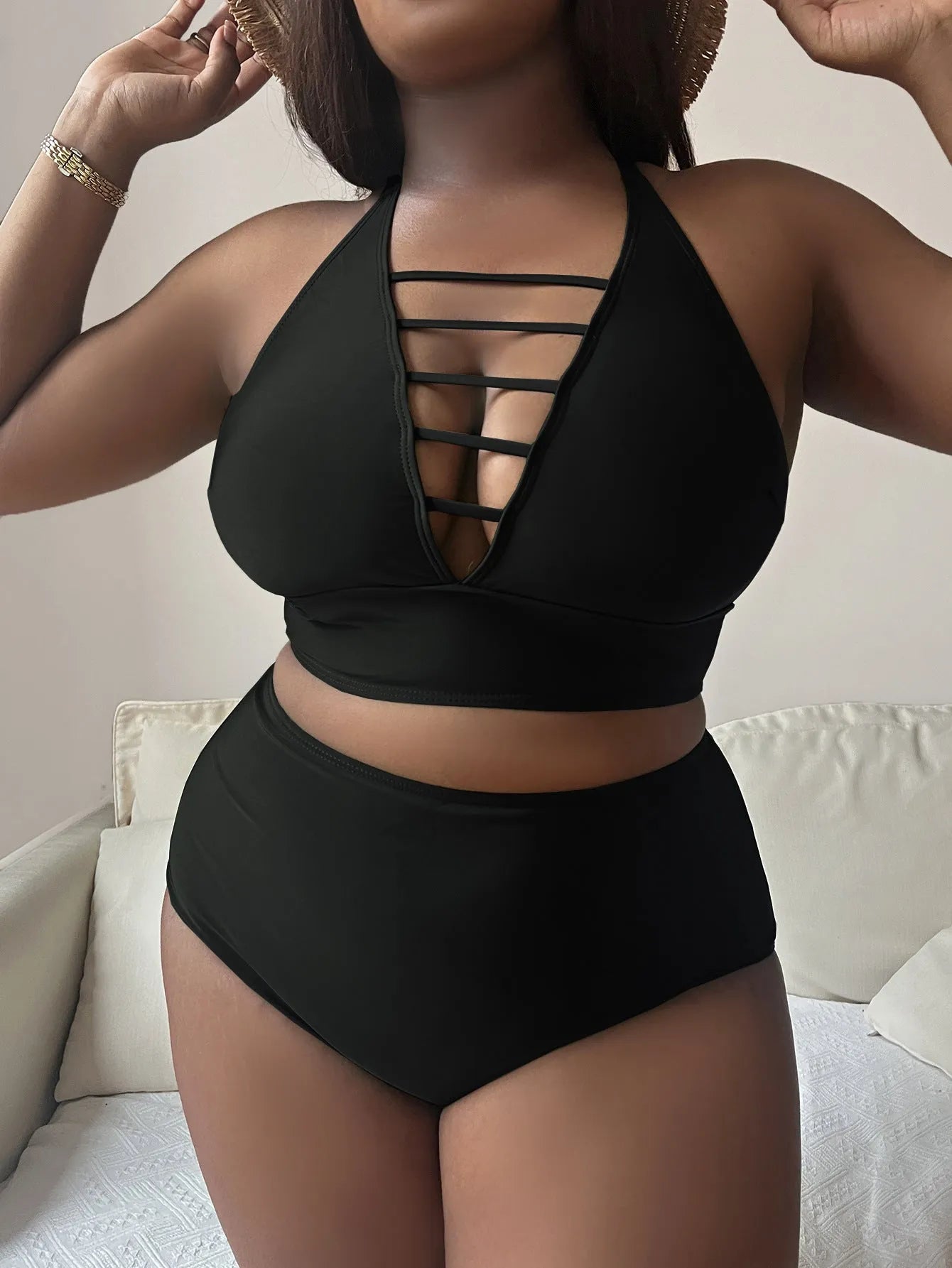 Plus size women's halter bikini with adjustable cross straps and high-waisted briefs in solid colour