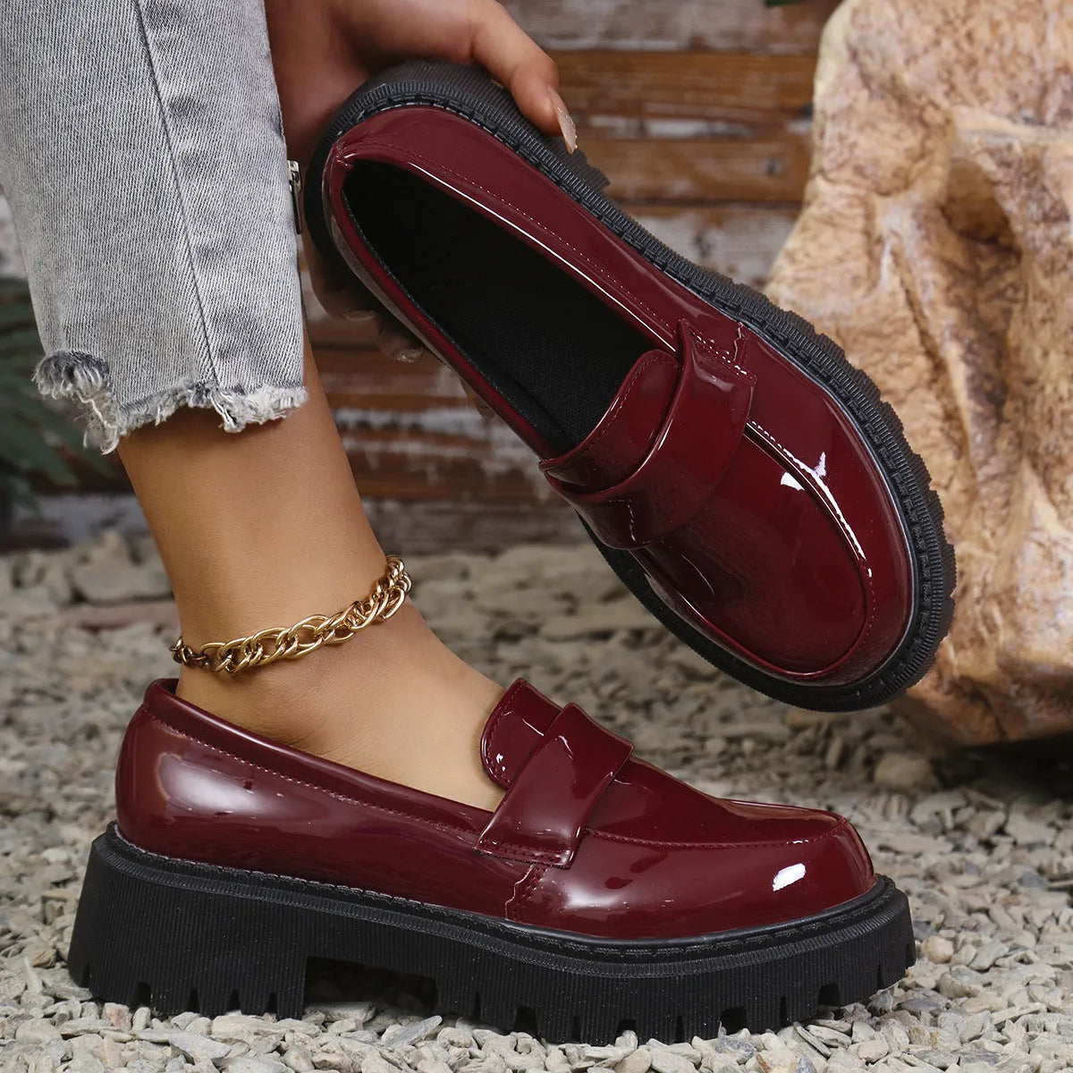 British-style slip-on loafers with a chunky mid heel and thick rubber platform sole.