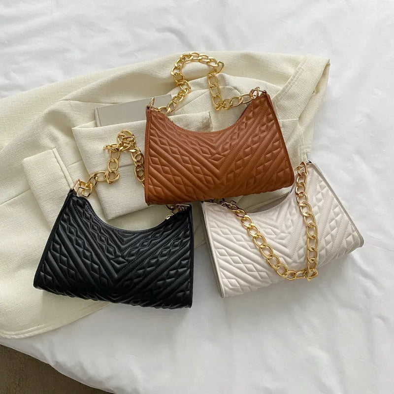 Brown pleated PU chain baguette shoulder bag showing square shape and soft handles.