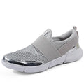 Blue, black, and grey women's lightweight sneakers with mesh lining and low-tube design.