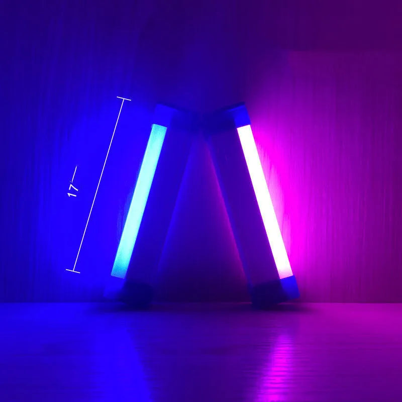 Blue and purple rechargeable LED tube stick light with dimmable settings.
