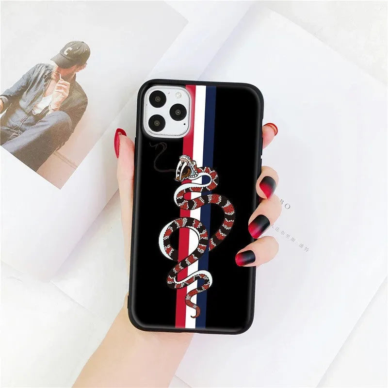 Black frosted silicone iPhone case featuring a cartoon snake design on the back.
