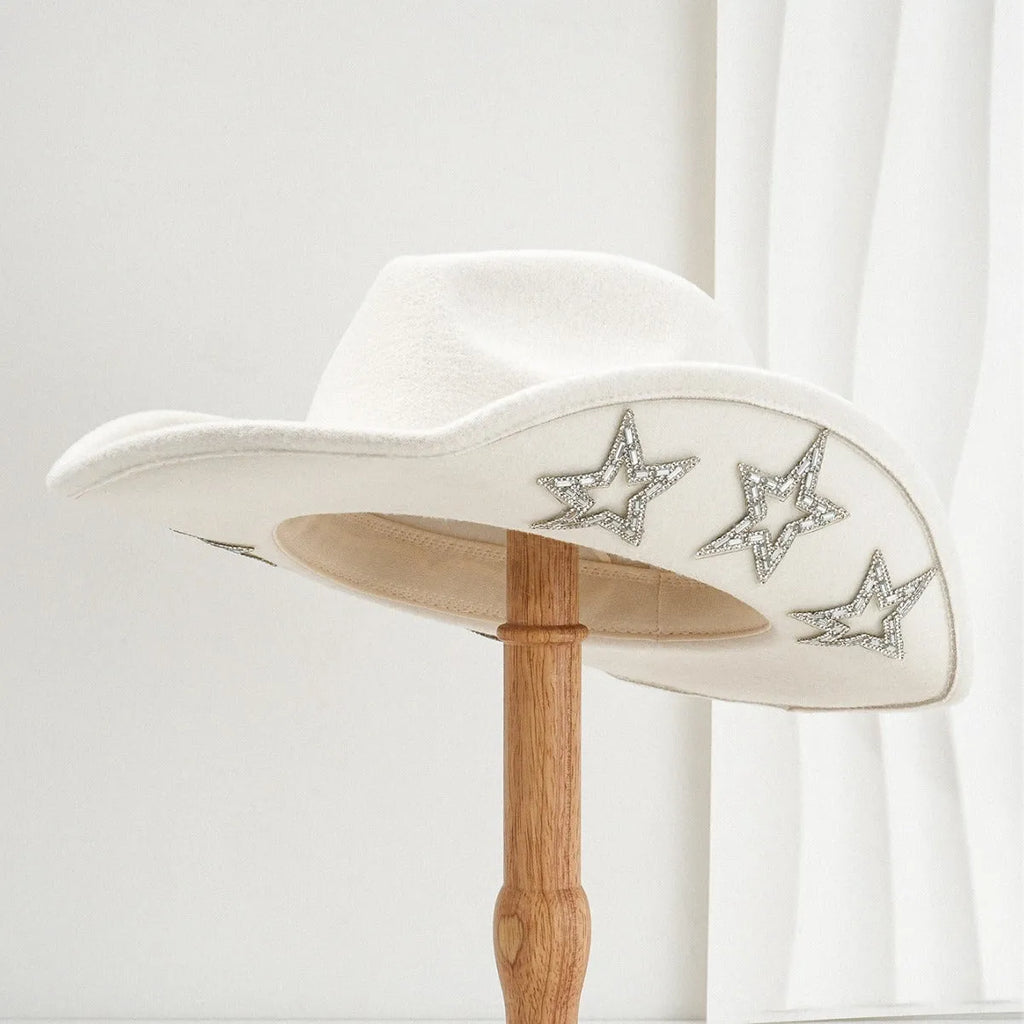 Beige woven polyester western top hat with a conical crown and a hexagonal star decoration on the front.