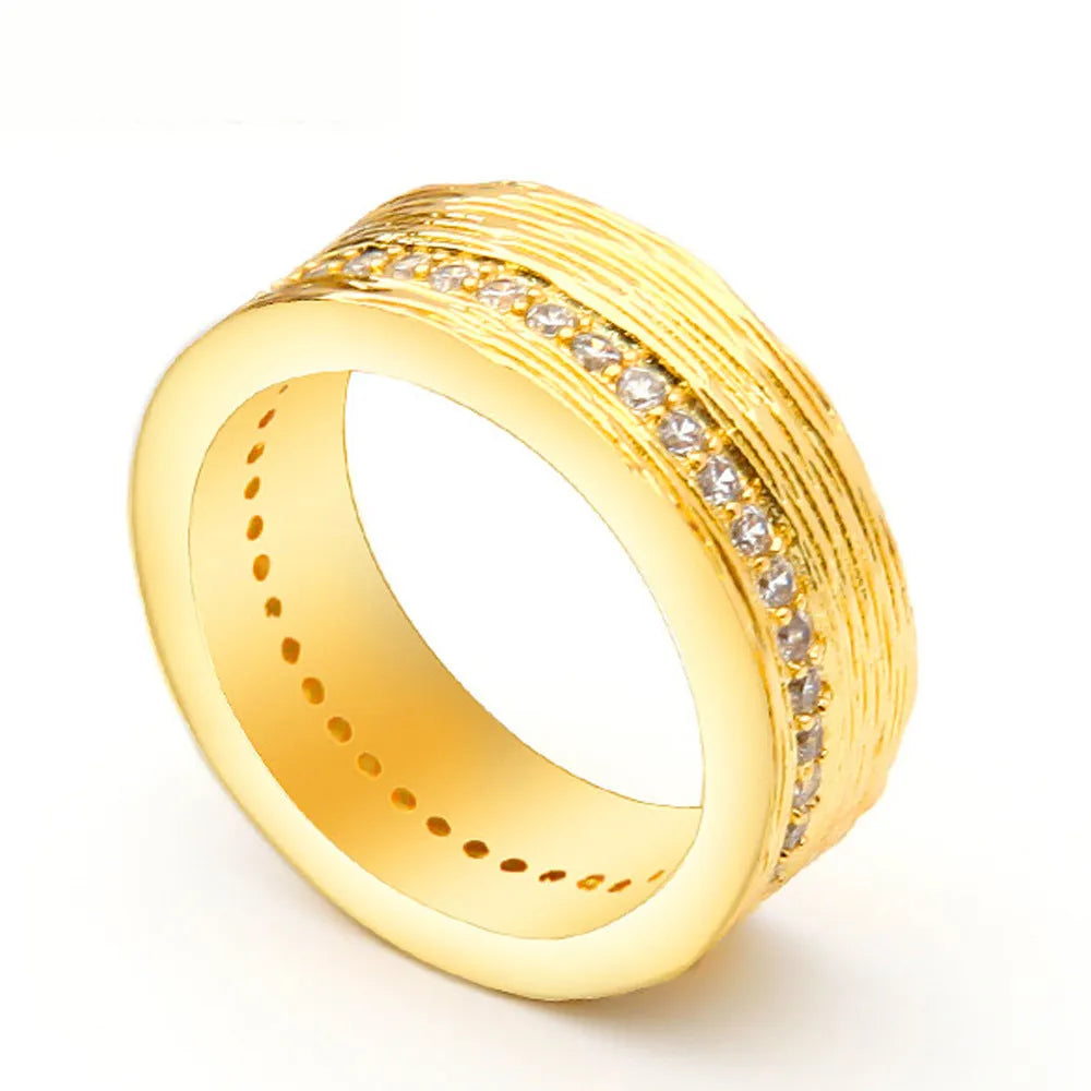 Gold geometric zircon ring for women on a white background, showing electroplated copper construction.