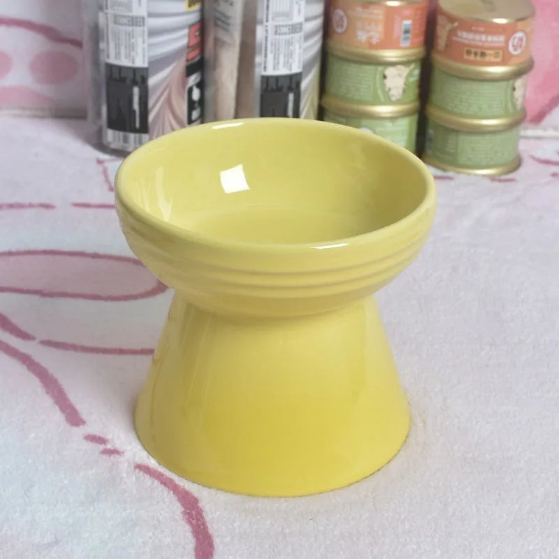 White ceramic pet bowl with a high foot neck and slanted rim for cat or dog feeding