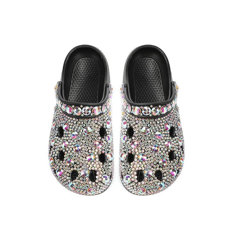 Black platform sandals for women with rhinestone detail and open-hole design on a lightweight EVA sole.