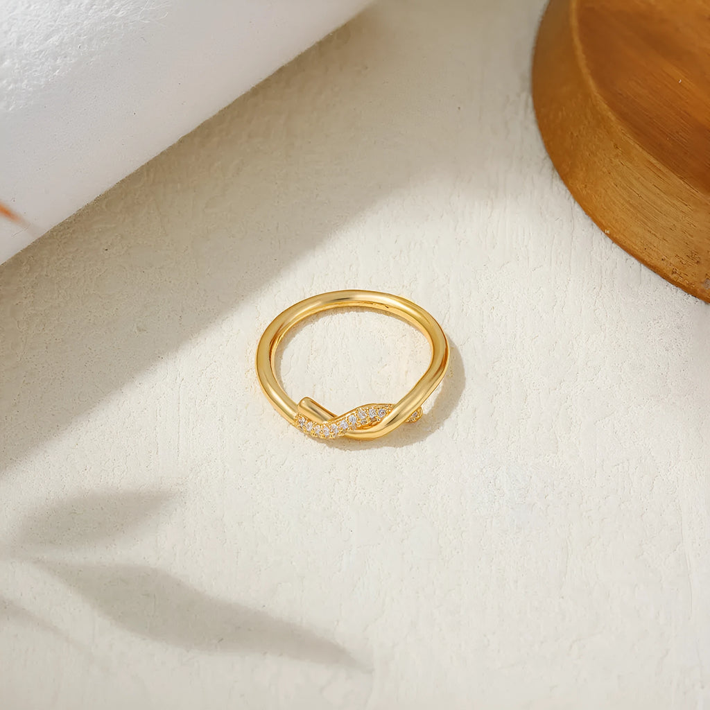 Knotted zircon ring with micro inlaid detail, copper electroplated wave bow design, unisex sizes 6 7 8