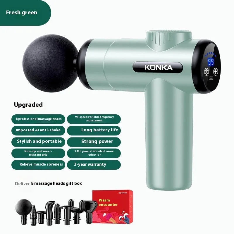 Konka V19 grey massage gun with multiple silicone attachment heads on a table.