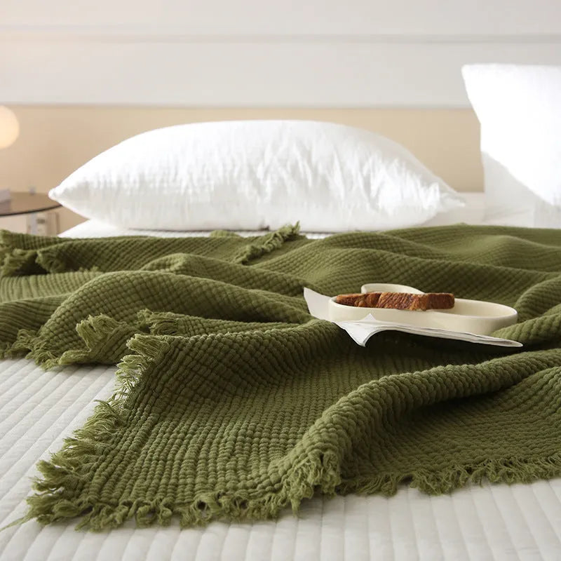 Four-layer cotton gauze blanket with tassel trim in navy blue colour