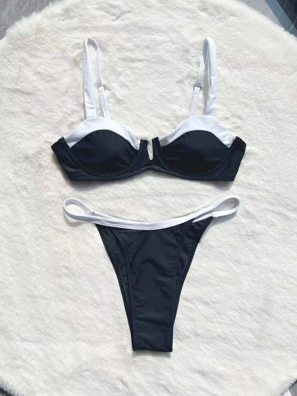 Black low waist bikini swimsuit for women with stitching split details on briefs-style bottoms