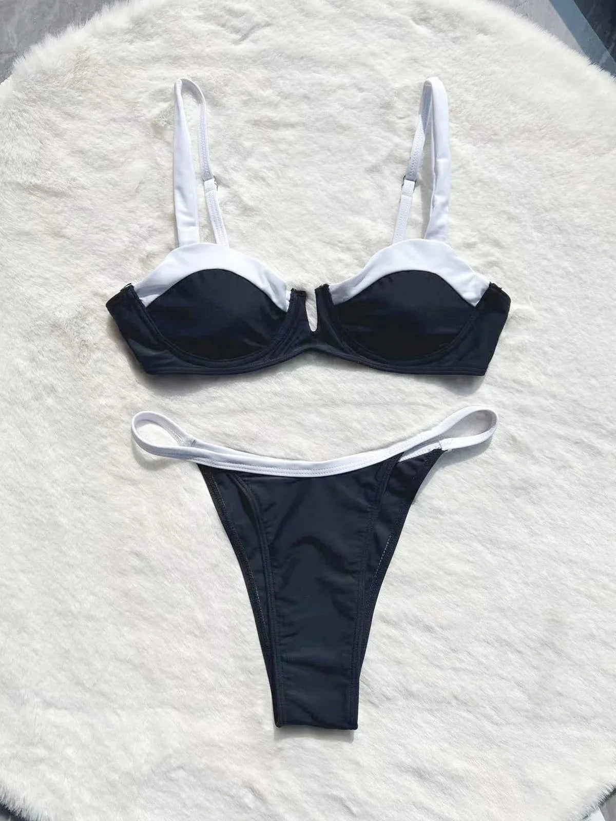 Black low waist bikini swimsuit for women with stitching split details on briefs-style bottoms