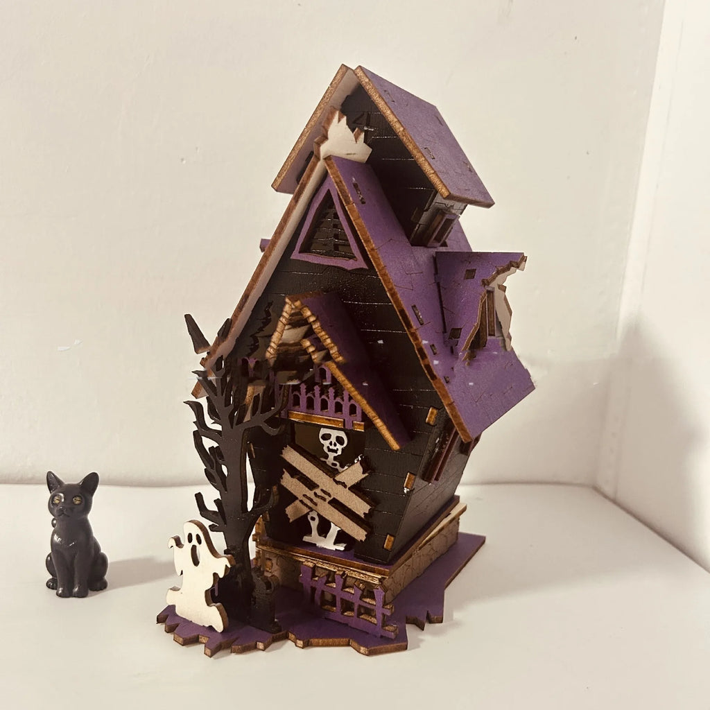 DIY wooden Halloween haunted house decoration kit with luminous design, shown with dimensions 14cm wide by 19cm high.