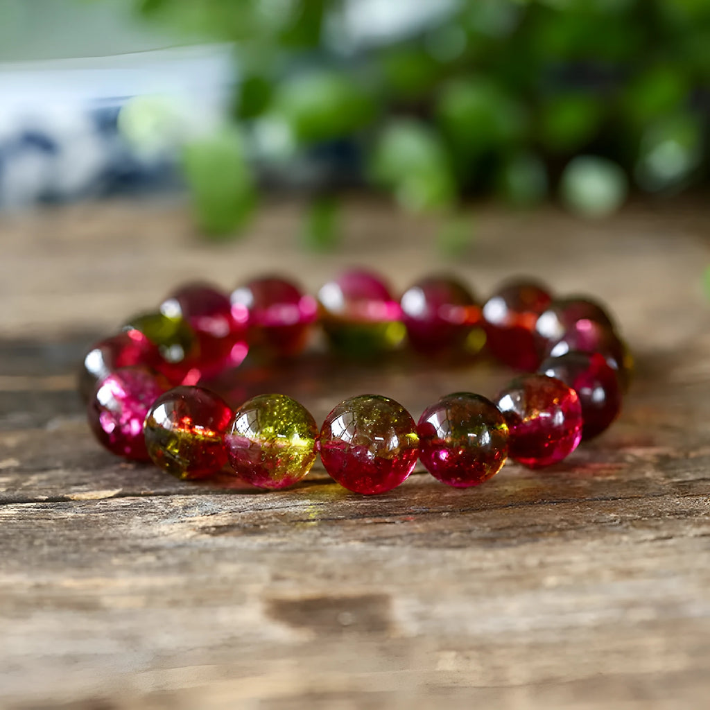 Close-up of a handmade pastel pink and green watermelon crystal bracelet for women, showing bead detail.