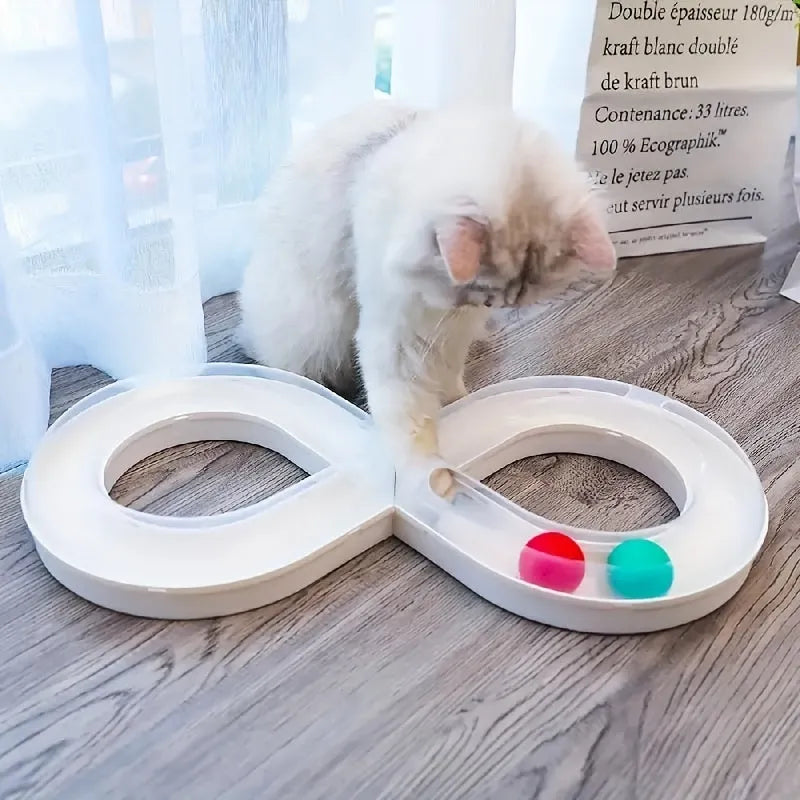 Cat toys set with rotating track ball turntable and teasing stick on white background