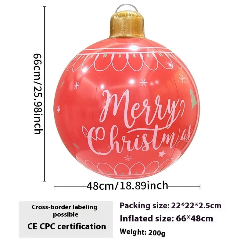 Large red and white inflatable Christmas ball with flashing lights in a garden setting