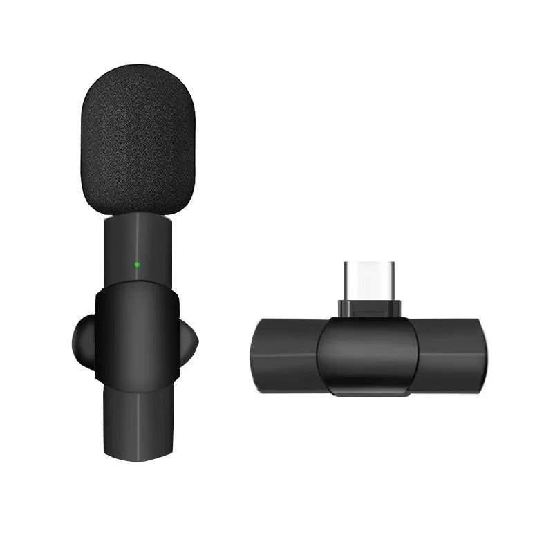 Close-up of a black wireless lavalier microphone with a clip, showing the TYPEC and Apple interface options on a mobile phone.