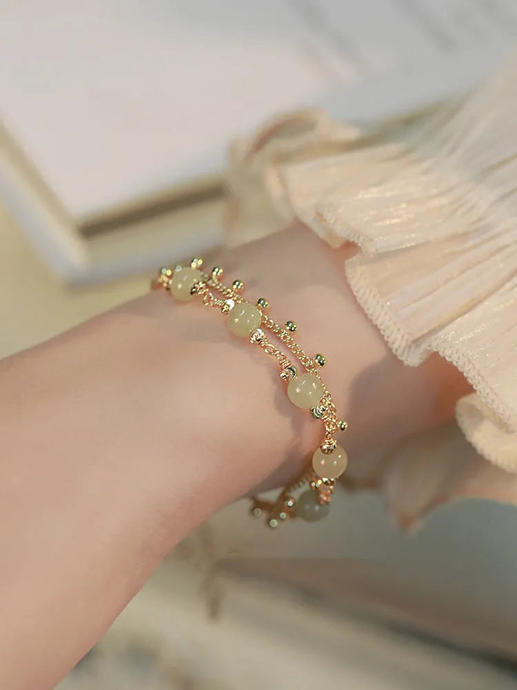 Natural Hetian Jade bracelet with princess running motif for women's daily wear.