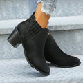 Black women's slip-on ankle boots with a pointed toe and thick square heel on a rubber sole.