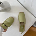 Women's beige retro fisherman flat sandals with canvas upper on a neutral background.