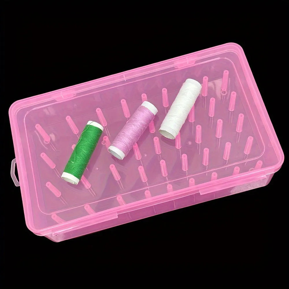 Plastic storage box with 42 compartments for organising embroidery threads and sewing kit items.