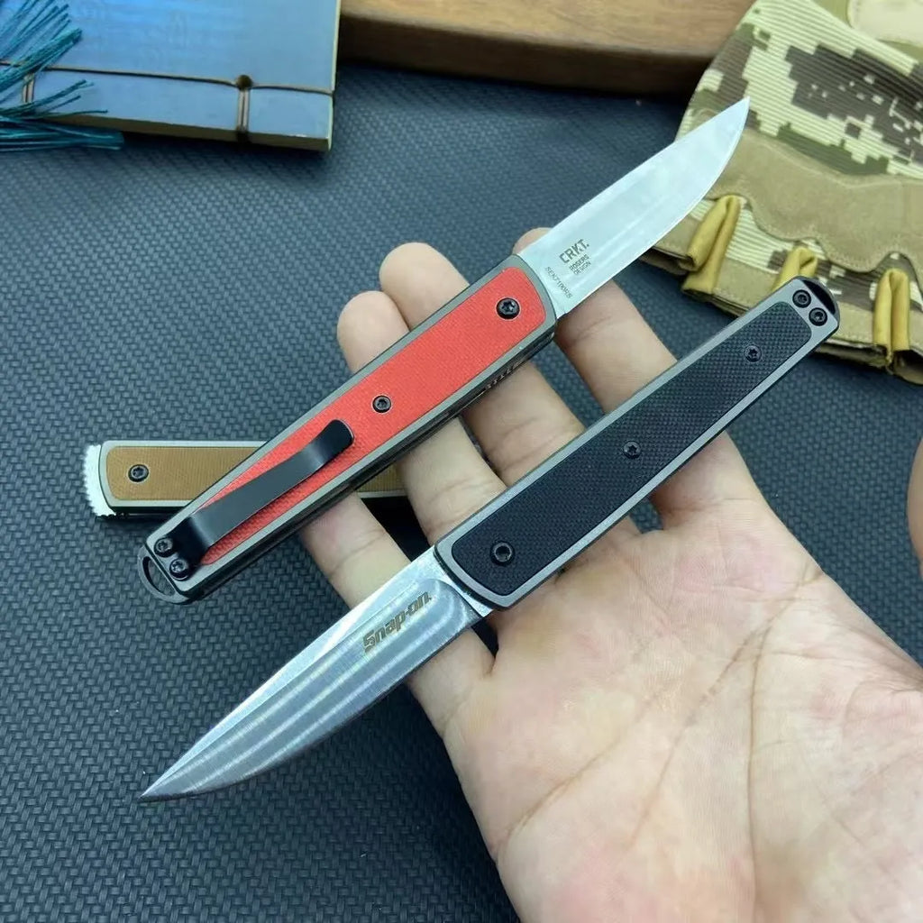 Folding fruit knife with stainless steel blade in black, brown, or red colour options showing 17cm length