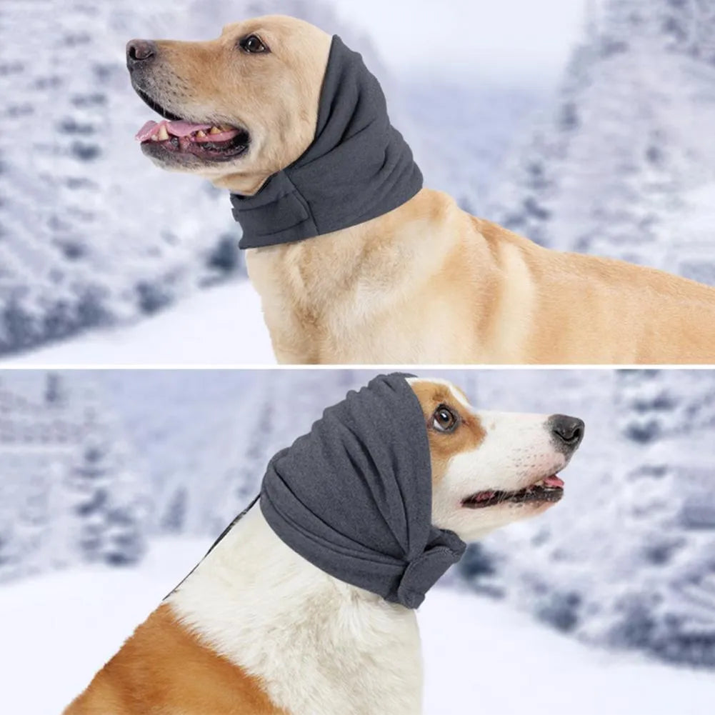 Dog wearing black calming hoodie covering ears with multi-purpose design for noise reduction and hair management
