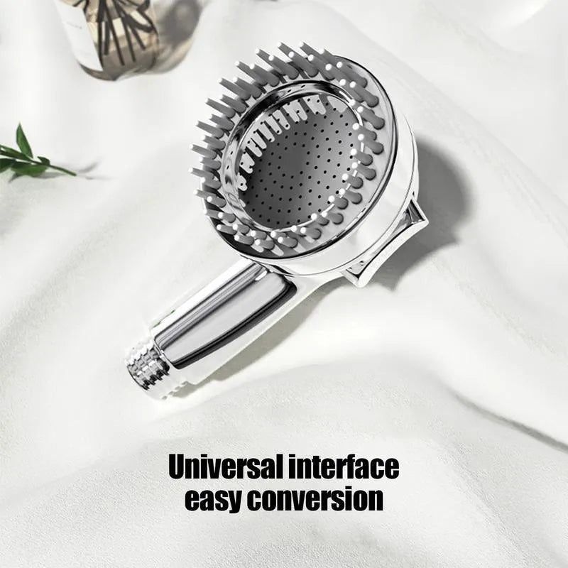 Silver coloured dog shower attachment with ergonomic grip and soft silicone comb teeth.