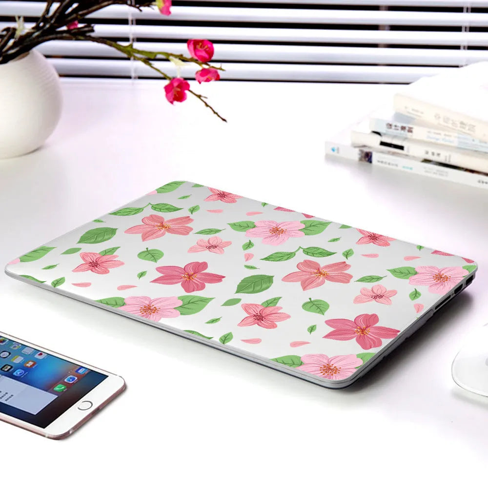 Plastic laptop protective shell with a floral pattern design for MacBook Air and MacBook Pro models.
