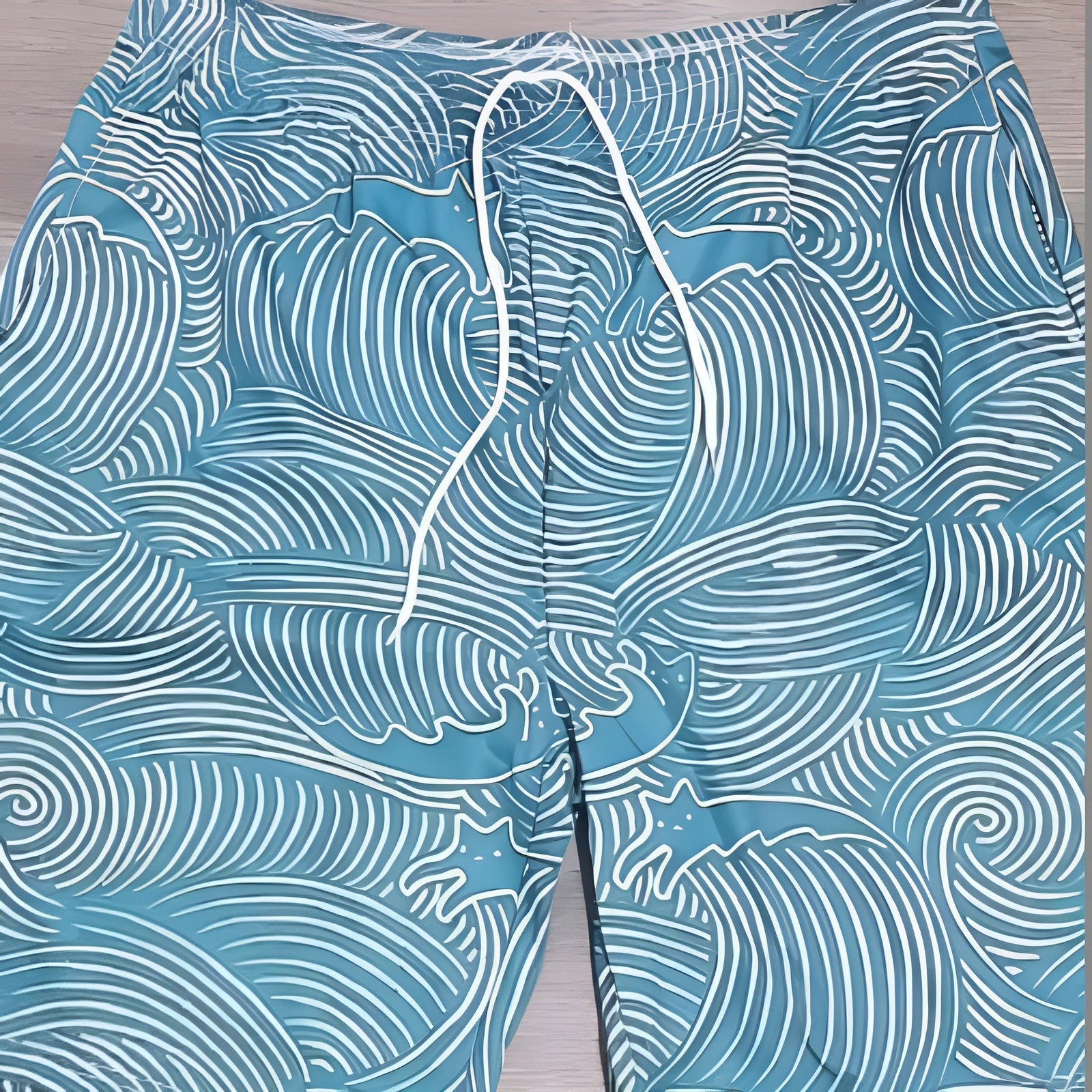 Men's straight-leg shorts with 3D digital printing on blue micro-elastic polyester fabric, laid flat.