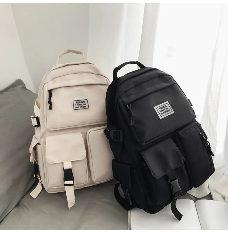 Soft nylon student backpack in black with three-dimensional pockets and laptop compartment