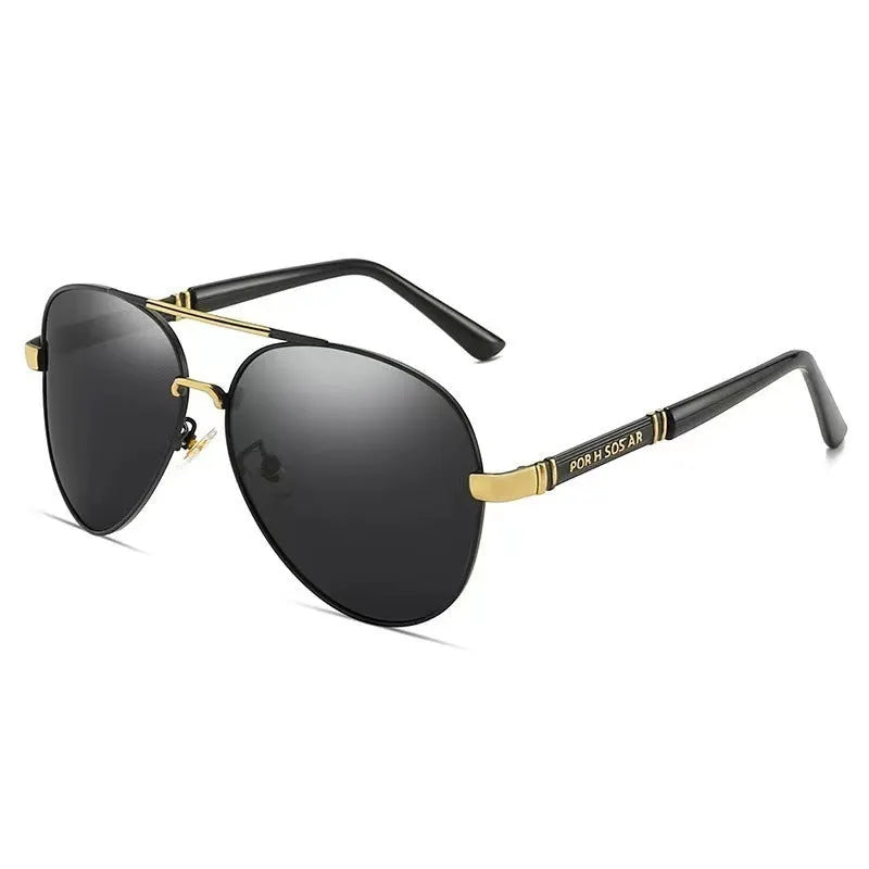 Gold metal frame polarised sunglasses with grey lenses on a table, showing dragon and phoenix temple detail.