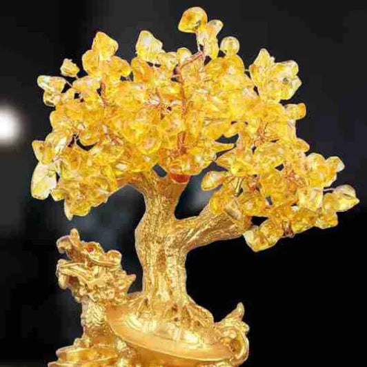 Citrine coloured resin money tree ornament with small water turtle model in Chinese style.